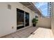 Private patio with sliding glass doors and potted plant at 331 Cleveland St # 317, Clearwater, FL 33755
