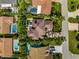 Overhead shot of a luxury home featuring a lush backyard, pool, and manicured landscaping at 620 Ponce De Leon Dr, Tierra Verde, FL 33715
