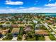 Breathtaking aerial view showcasing the vibrant neighborhood with lush greenery and community features at 620 Ponce De Leon Dr, Tierra Verde, FL 33715