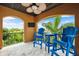Relaxing balcony featuring comfortable seating and a beautiful view of tropical foliage and blue skies at 620 Ponce De Leon Dr, Tierra Verde, FL 33715