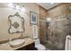 Modern bathroom featuring a marble countertop, vessel sink, and glass shower at 620 Ponce De Leon Dr, Tierra Verde, FL 33715
