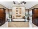 Luxurious bathroom features a soaking tub with decorative tile accent wall, and dark wood cabinets at 620 Ponce De Leon Dr, Tierra Verde, FL 33715