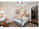 Cozy bedroom with dark wood floors, ceiling fan, and neutral walls at 620 Ponce De Leon Dr, Tierra Verde, FL 33715