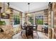 Cozy breakfast nook with bright windows, offering a peaceful spot for morning meals at 620 Ponce De Leon Dr, Tierra Verde, FL 33715