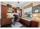 Home office with custom built-ins, desk space, and a window seat at 620 Ponce De Leon Dr, Tierra Verde, FL 33715