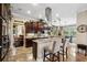 Spacious kitchen with stainless steel appliances, granite countertops, and breakfast bar seating at 620 Ponce De Leon Dr, Tierra Verde, FL 33715