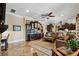 Open-concept living area with custom cabinetry, a wine fridge, and comfortable seating arrangements at 620 Ponce De Leon Dr, Tierra Verde, FL 33715