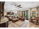 Expansive living room with kitchen view, perfect for entertaining with abundant natural light and stylish finishes at 620 Ponce De Leon Dr, Tierra Verde, FL 33715