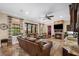 Inviting living room with a stone fireplace, comfortable seating, and plenty of natural light at 620 Ponce De Leon Dr, Tierra Verde, FL 33715