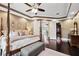 Open main bedroom with dark wood floors and views into other rooms offers a harmonious layout at 620 Ponce De Leon Dr, Tierra Verde, FL 33715