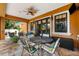 Inviting outdoor patio area complete with stylish furniture and a ceiling fan for comfortable entertaining at 620 Ponce De Leon Dr, Tierra Verde, FL 33715