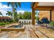Outdoor pool with a patio and lush landscaping at 620 Ponce De Leon Dr, Tierra Verde, FL 33715