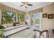 Sitting room with views has bench seating and sliding glass doors to the outside deck at 620 Ponce De Leon Dr, Tierra Verde, FL 33715