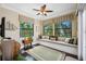 Comfortable sitting area with window seating, a ceiling fan and nice natural light at 620 Ponce De Leon Dr, Tierra Verde, FL 33715