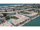 An aerial view of the building highlighting the pool and waterfront access at 6201 2Nd E St # 73, St Pete Beach, FL 33706