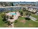 An aerial view showcases the pool, mature landscaping, and proximity to the waterfront at 6201 2Nd E St # 73, St Pete Beach, FL 33706