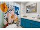 Colorful bathroom featuring a vanity, unique shower curtain and mirror, adding a vibrant touch at 6201 2Nd E St # 73, St Pete Beach, FL 33706