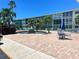 Well-maintained community with a water fountain, tables, and lush landscaping at 6201 2Nd E St # 73, St Pete Beach, FL 33706