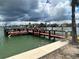 Waterfront dock offering access to calm waters for boating and other recreational activities at 6201 2Nd E St # 73, St Pete Beach, FL 33706