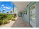Condo exterior featuring lush landscaping, nearby condos and close beach access at 6201 2Nd E St # 73, St Pete Beach, FL 33706