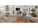 Inviting living room boasts stylish decor, wood floors, and access to a bright bedroom, offering a seamless layout at 6201 2Nd E St # 73, St Pete Beach, FL 33706