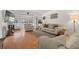 Bright living room showcasing stylish furniture, wood flooring and a large window with views in an inviting space at 6201 2Nd E St # 73, St Pete Beach, FL 33706