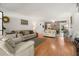 Spacious living room with wood floors, comfortable seating, and a dining area, great for relaxation and entertaining at 6201 2Nd E St # 73, St Pete Beach, FL 33706