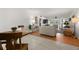 Open-concept living and dining area with wood floors, creating a spacious and connected living experience at 6201 2Nd E St # 73, St Pete Beach, FL 33706