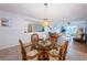 Dining area with glass-top table and wicker chairs at 12760 Indian Rocks Rd # 1036, Largo, FL 33774
