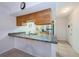 Kitchen with granite countertop and stainless steel refrigerator at 12760 Indian Rocks Rd # 1036, Largo, FL 33774