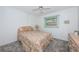 Bedroom with full-size bed and ceiling fan at 12760 Indian Rocks Rd # 1036, Largo, FL 33774