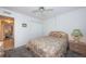 Full-size bed in well-lit guest bedroom at 12760 Indian Rocks Rd # 1036, Largo, FL 33774