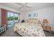 Main bedroom with king-size bed and balcony access at 12760 Indian Rocks Rd # 1036, Largo, FL 33774