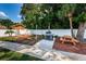 Community BBQ area with picnic tables and gas grill at 12760 Indian Rocks Rd # 1036, Largo, FL 33774