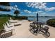 Enjoy waterfront views from this patio, complete with lounge chairs and tables at 12760 Indian Rocks Rd # 1036, Largo, FL 33774