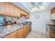 Kitchen with light wood cabinets and stainless steel appliances at 12760 Indian Rocks Rd # 1036, Largo, FL 33774
