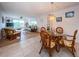 Open concept dining area with adjacent living room and kitchen at 12760 Indian Rocks Rd # 1036, Largo, FL 33774