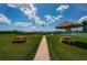 Relaxing community picnic area with benches, tables, and waterfront views at 12760 Indian Rocks Rd # 1036, Largo, FL 33774