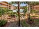 Ground-level view of the community pool and landscaping at 12760 Indian Rocks Rd # 1036, Largo, FL 33774