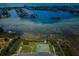 Aerial view showcasing community tennis courts and waterfront location at 12760 Indian Rocks Rd # 1036, Largo, FL 33774