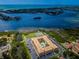 Aerial view of waterfront condo community with pool and tennis courts at 12760 Indian Rocks Rd # 1036, Largo, FL 33774