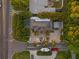 Overhead aerial of a home with a boat, a circular driveway, and tropical landscaping at 6465 30Th S St, St Petersburg, FL 33712