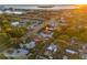 Aerial view of neighborhood featuring a blue single-story home near the waterfront at 6465 30Th S St, St Petersburg, FL 33712