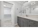 A bathroom featuring a vanity, medicine cabinet, and a closet on the left side at 6465 30Th S St, St Petersburg, FL 33712