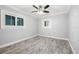 A bedroom featuring wood-look flooring, neutral walls, and white trim at 6465 30Th S St, St Petersburg, FL 33712