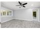 Bright bedroom with wood-look flooring, neutral paint, white trim, and large window at 6465 30Th S St, St Petersburg, FL 33712