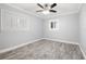 A bedroom featuring wood-look flooring, neutral walls, and white trim at 6465 30Th S St, St Petersburg, FL 33712