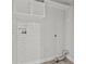 A laundry room featuring subway tile, shelving and a gray tile floor at 6465 30Th S St, St Petersburg, FL 33712