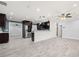 Open-concept layout with living area featuring stylish wood-look floors and easy access to a modern kitchen at 6465 30Th S St, St Petersburg, FL 33712
