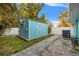 Cozy backyard shed with a new AC unit and ample storage, surrounded by a white privacy fence at 6465 30Th S St, St Petersburg, FL 33712